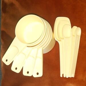 Vintage Tupperware measuring cups & spoons. All items shown-5 spoons/4 cups